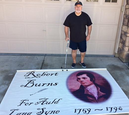 Don Burns with banner